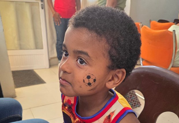 A child with face paint at one of our activities