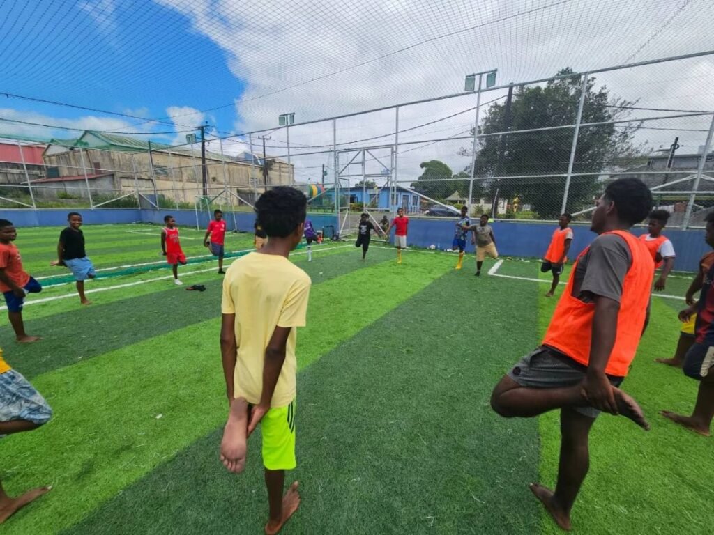 Young people warming up at a football training session